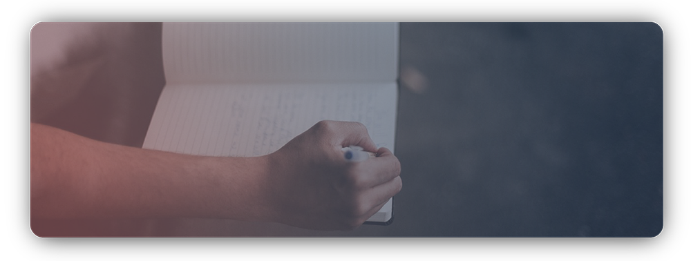 Woman sitting and writing in a journal